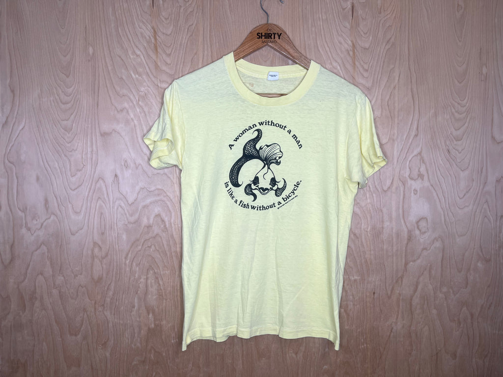 1976 Seattle National Organization for Women “A woman without a man is like a fish without a bicycle” - Medium